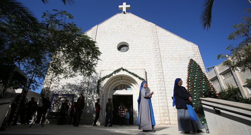 Palestinian,Christian,Worshipers,Gather,As,They,Attend,A,Ceremony,Inside